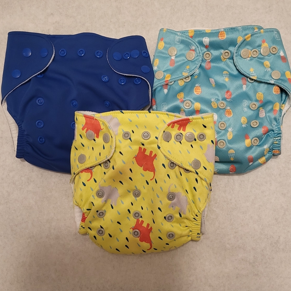 Three "Lil helper" cloth diapers with inserts